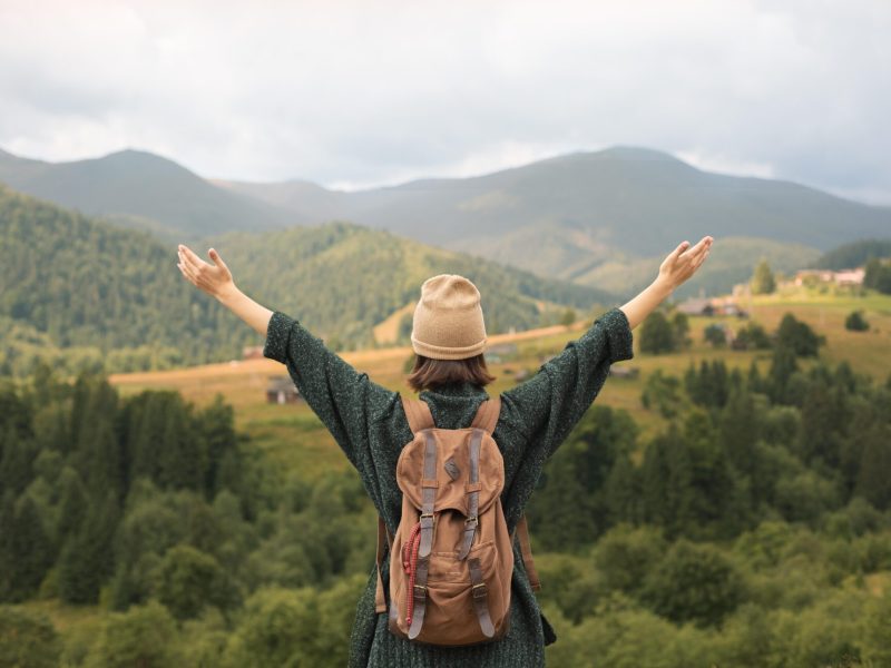 young-female-traveler-enjoying-rural-surroundings